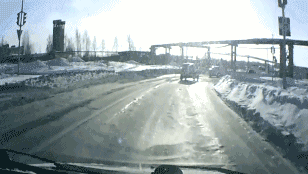 russia-dashboard-cam-tank-drives-across-road-snow-1359329911C
