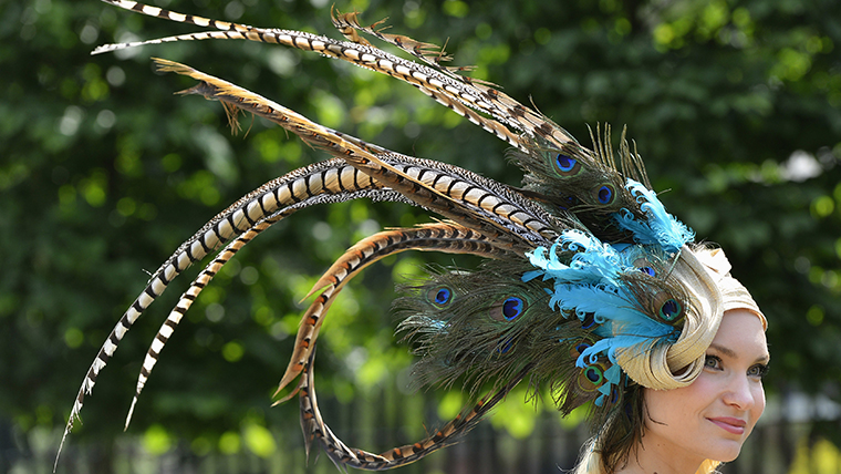 A racegoer arrives on the second day of the Royal Ascot horse racing festival at Ascot