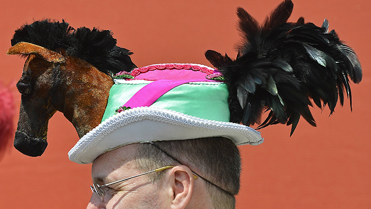 Racegoer wears an equine-themed hat on the second day of the Royal Ascot horse racing festival at Ascot in southern England